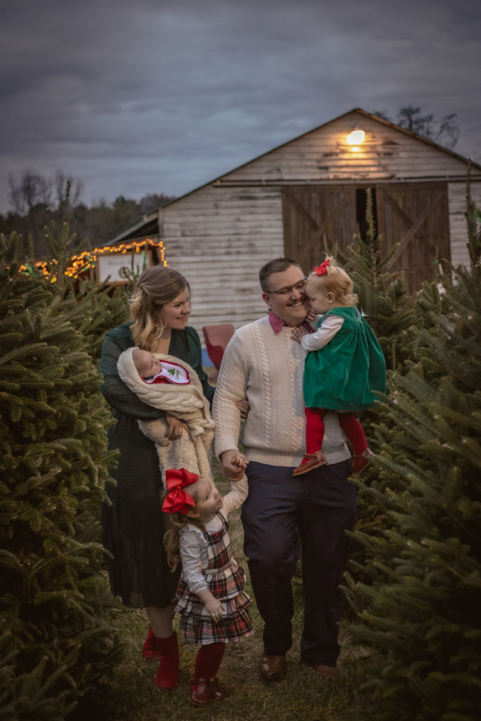 Family Christmas photos at Christmas tree farm