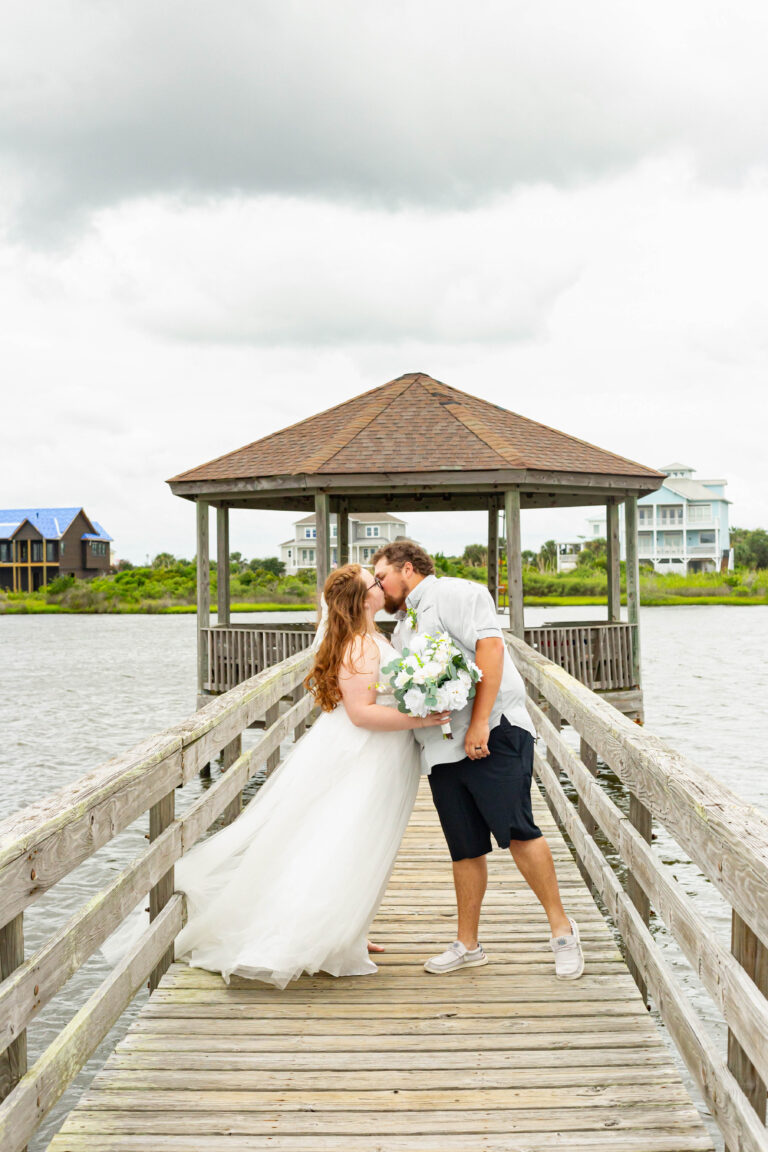 Denver NC Wedding Photographer caoturing the first few kisses as husband and wife for this Maiden NC couple